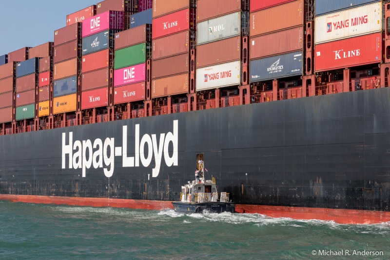 3 of 7:  A canal pilot exits a container ship.