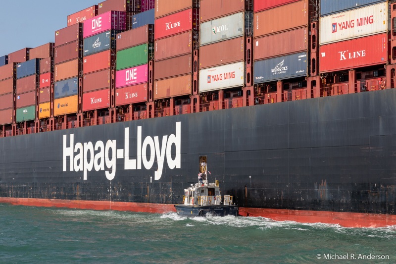 3 of 6:  A canal pilot exits a container ship.