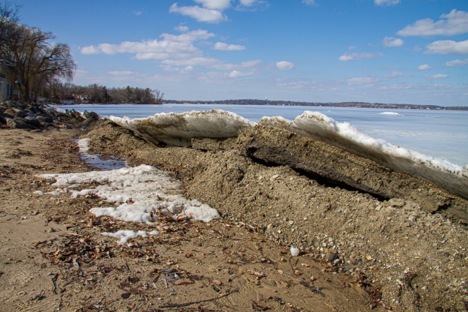 Ice pushes up onto a beach